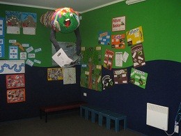 The walls of our library are the same colour and pattern as our webpages!         Blue is our school colour and Green because we are an Enviroschool.